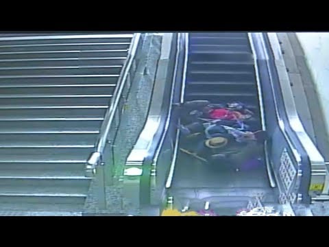 grandma mother baby fall down escalator