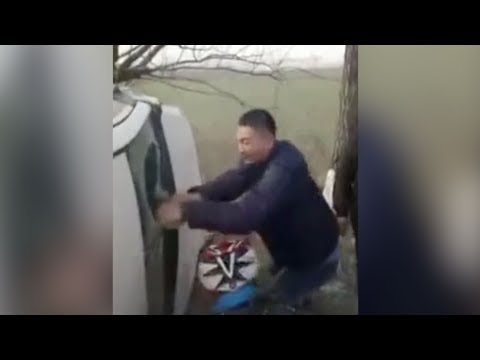 man tears open car sunroof