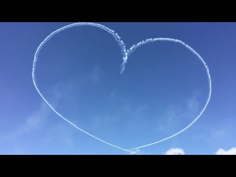 planes trace a heart with contrails
