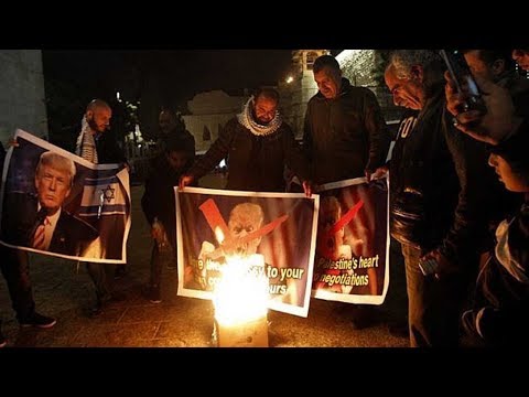 palestinian protesters burn posters of trump after move