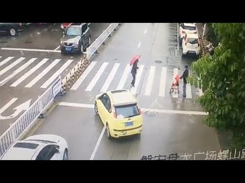 car blocks traffic to allow old woman