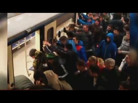 see dozens of passengers push train to rescue woman